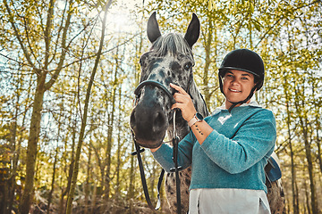 Image showing Portrait of woman with horse in woods, smile and pride for competition, race or dressage with trees. Equestrian sport, face of jockey or rider with animal in forest for adventure, training and care.