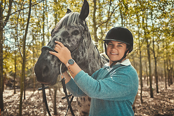 Image showing Portrait of woman with horse in forest, smile and pride for competition, race or dressage with trees. Equestrian sport, face of jockey or rider with animal in woods for adventure, training and care.