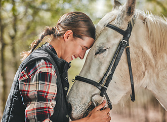 Image showing Happy woman with horse in forest, embrace in nature and love for animals, pets or dressage with trees. Equestrian sport, girl jockey or rider standing in woods for adventure, hug and smile on face.
