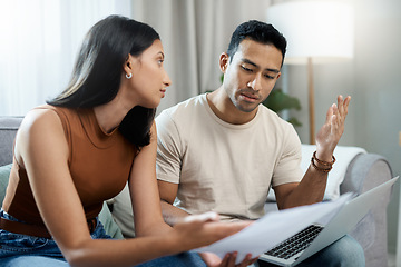 Image showing Frustrated couple, laptop and financial crisis in debt, mistake or argument on living room sofa at home. Man and woman with computer in disagreement for finance, mortgage expenses and bills at house