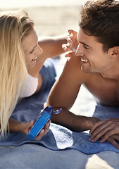 Image showing Beach, couple and apply sunscreen for face care hydration, wellness support or woman helping with UV protection. Sun cream application for nature man with skin safety, solar security or SPF sunblock