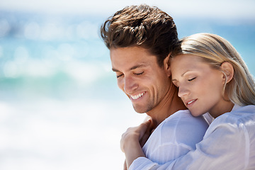 Image showing Happy, couple and hug by the beach on travel, vacation and trip date with a smile and embrace. Romance, summer and holiday by the sea and ocean with young people together on a break in Miami outdoor