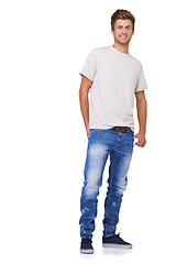 Image showing Fashion, smile and portrait of man in a studio with casual, stylish and trendy outfit for confidence. Handsome, happy and full body of model with tshirt and jeans style isolated by white background.