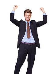 Image showing Business man, winner and portrait in studio for success, achievement or winning of bonus, sales or profit. Excited corporate worker with fist, yes and celebration or opportunity on a white background