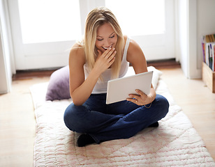 Image showing Woman, tablet and laugh for social media in home, sitting and floor for relaxing. Female person, gesture and smile for funny joke with technology for online, movie or streaming service in living room