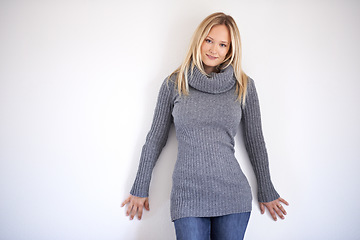 Image showing Portrait, fashion and woman in studio with winter, clothing or outfit, confidence or pose on white background. Style, face and female model in cosy, trendy or fashionable clothes and positive mindset