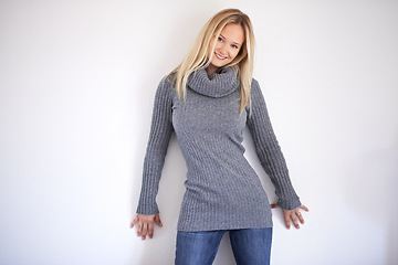 Image showing Fashion portrait and woman in studio with winter, clothing or outfit, confidence or pose on white background. Style, face and female model in cosy, trendy or fashionable clothes and positive mindset