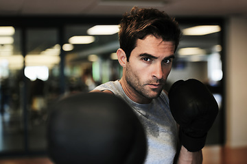 Image showing Man, boxing gloves and punch with gym for fitness, wellness or training for fight, performance or sport. MMA, boxer or strong for contest, competition or exercise for development, sweat and workout