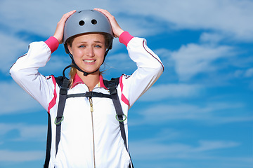 Image showing Skydiving, worry and portrait of woman on adventure with helmet and anxiety or stress on sky background. Nervous, skydiver and face with fear at the start of stunt in countryside with safety gear