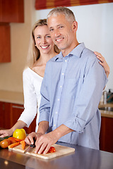 Image showing Kitchen, cooking and portrait of couple with vegetables for healthy dinner, lunch and ingredients. Retirement, marriage and mature man and woman cutting food for bonding, help and meal prep at home