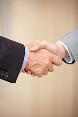 Image showing Business people, handshake and meeting in b2b, partnership or deal together in teamwork at office. Closeup of employees shaking hands in thank you for hiring, agreement or recruiting on mockup space