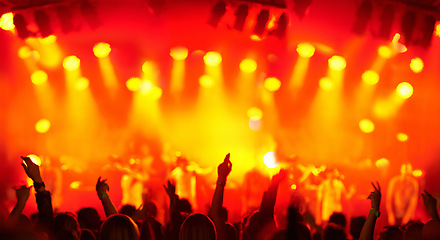 Image showing Crowd silhouette, music festival lights and band concert audience listen to artist, stage performance or rock star. Night show entertainment, excited group energy and back of fans cheers for musician