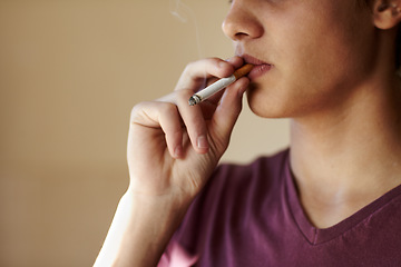 Image showing Teenager, hand and cigarette closeup for smoking student unhealthy habit, dangerous or addiction. Male person, fingers and tobacco risk or stress management for lungs pain, bad quit problem of cancer