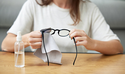 Image showing Woman, hands and clean glasses from dirt or seeing health, microfiber cloth for lenses. Female person, wipe frame and spectacles for bacteria for clear vision with tissue for reading, safety for eyes