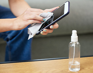 Image showing Woman, hand and clean phone screen or wipe hygiene bacteria, dust wellness or virus safety. Female person, mobile device and cloth for disinfection from germs or surface sanitizer, protection or risk