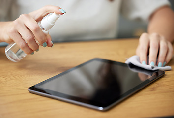 Image showing Hand, spray tablet and cloth for screen, dust or dirt with shine on glass, hygiene or disinfection in home. Woman, digital touchscreen and fabric, chemical or sanitation for bacteria, virus or health