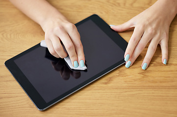 Image showing Hand, cleaning tablet and cloth for screen, dust and dirt with shine on glass, hygiene or disinfection in home. Woman, digital touchscreen and fabric, wipe or sanitation for bacteria, virus or health