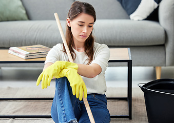 Image showing Spring cleaning, home and woman with fatigue, tired and sad with burnout, bored and maid service problem. Person, housekeeping and girl with gloves, frustrated and overworked with stress or exhausted