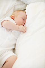 Image showing Sleeping, bed and baby with pillow in home for dreaming, resting and nap for child development. Family, nursery and comfortable newborn infant in bedroom relax for wellness, health and growth