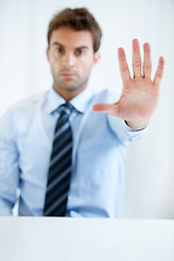 Image showing Businessman, hands and stop for wait, no or halt in gesture, protest or take a stand at office. Man, male person or employee showing palm for negative sign, disapproval or disagree at workplace
