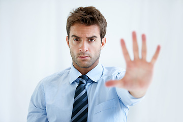 Image showing Businessman, portrait and hands stop for wait, no or halt in gesture, protest or take a stand at office. Man, male person or employee show palm for negative sign, disapproval or disagree at workplace
