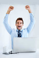 Image showing Business man, winner and computer for trading success, achievement or winning of bonus, sales or profit. Excited portrait of a trader with fist, yes and celebration on laptop and a white background