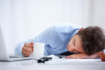 Image showing Business man, sleeping and tired at work, burnout and exhausted or mental health, desk and overwhelmed. Male person, dreaming and lazy in office, resting and fatigue or low energy, coffee and nap