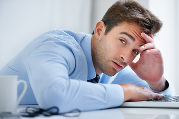 Image showing Tired, desk and portrait of business man in office on laptop working on deadline, project and online report. Corporate, burnout and face of exhausted, fatigue and overworked employee on computer