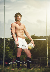 Image showing Portrait, rugby and fitness man with ball on field for training, wellness and morning cardio outdoor. Handball, exercise or topless male player happy at stadium for competition, action or performance