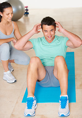 Image showing Personal trainer, fitness and portrait of man sit up in exercise and workout for health, wellness and cardio, People, training or coach helping person with core, crunches and pilates routine in gym