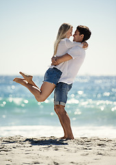 Image showing Couple, hug and fun by beach in summer with love, care and support together on a holiday. Happy, vacation and date smile by the sea in Miami with freedom and travel by the ocean on a trip outdoor