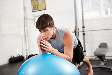 Image showing Gym, exercise ball and man with fitness, training and bodybuilder with routine, muscle and progress. Person, athlete and guy with equipment, workout and health with energy, wellness and challenge