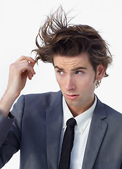 Image showing Chaos, crazy hair and business man with doubt and confused from stress and anxiety. Studio, male professional and working with corporate job and thinking with wild hairstyle and white background