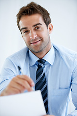 Image showing Business man, portrait and documents or writing information in POV job interview or recruitment meeting in HR. Smile, face and professional employer with documents, resume and CV or hiring contract