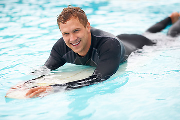 Image showing Portrait, man and surfer in sea with board, health fitness and happy in summer with water sports. Person, smile and face of relax wellness in caribbean with vacation, adventure and workout in ocean