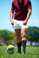 Image showing Legs, athlete and player with rugby ball for sports workout or training on a field. Feet, fitness and man ready for competitive exercise in a uniform for sporty fun with an active game outdoors