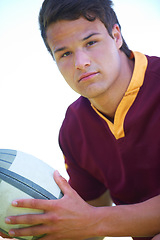 Image showing Portrait, serious and rugby player with a ball for competitive sport and practice on a field. Focus, fitness and male athlete person with an object for exercise and training for a healthy game