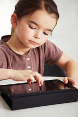 Image showing Little girl, tablet and watching in living room for online entertainment, games or research at home. Face of young female person, child or kid with technology for communication or networking at house