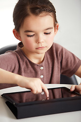 Image showing Little girl, tablet and watching in living room for games, online entertainment or research at home. Face of young female person, child or kid with technology for communication or networking at house