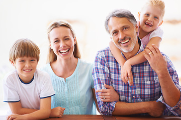 Image showing Portrait, smile and family relax at home for bonding love and care. Face, happiness and daughter hugging father in the living room and enjoying loving rest with her kid brother and mother embrace