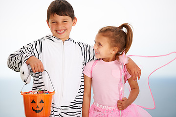 Image showing Family, children and siblings with halloween, costume or hug outdoor with love, care or fun together. Happy, smile and kids in character for festival, holiday or fantasy, playing or bond with freedom