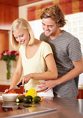 Image showing Couple, cutting vegetables and kitchen for healthy nutrition, dinner meal or vegetarian diet. Man, woman and knife for cooking preparation for vitamin salad food together, home hug for eating hungry