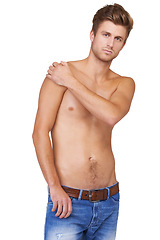 Image showing Man, portrait and serious in studio with topless, jeans and confident for wellness, health and calm expression. Person, face and shirtless with hands or assertive on mock up space or white background