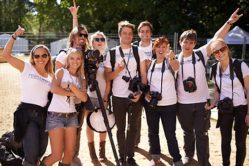 Image showing Portrait, group and teamwork with photographers, outdoor and musical festival with joy, cheerful and excited. People, men or women with equipment, cameras and collaboration with event, party or smile