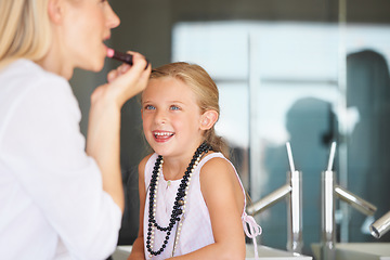 Image showing Mother, child and smile for cosmetics, makeup and support in bathroom, lipstick and fun at home. Mom, daughter and learning or play, beauty and skincare or bonding, love and teaching or grooming