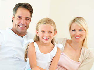 Image showing Family, portrait and happy on sofa with relax, peace and love for bonding and relationship in living room. Parents, girl kid or face and smile on couch of lounge for care, break and enjoyment in home