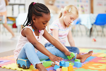 Image showing Education, kindergarten and children with toys for playing, child development and creative learning. School, youth and young girls with building blocks for fun, relax and educational games on floor