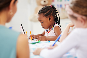 Image showing African, kid and pencil for drawing in classroom for learning, education and development of motor skills. Little girl, student on learner with serious, determination and look for creative activity