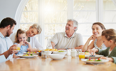 Image showing Dinner, children and happy in big family home with eating, talk and laugh with mom, dad and grandparents. Men, women and kid for food, lunch or brunch for memory, conversation or smile in dining room