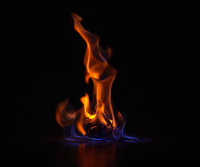 Image showing Gas flame, heat and fire with black background with night, start and light from burning in studio. Fuel, flare and glow from thermal power and art in the dark with creativity and inferno with burn